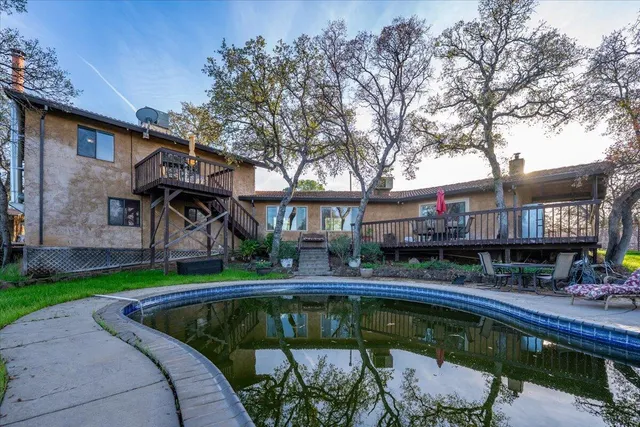 a front view of a house with porch and wooden floor