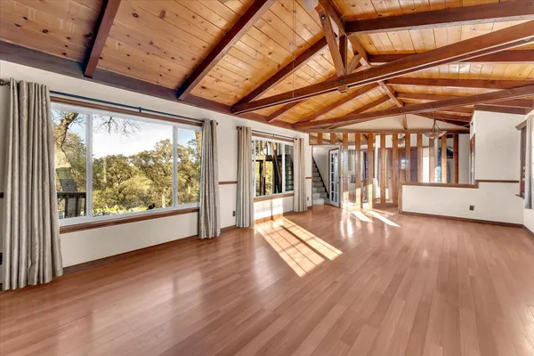a view of livingroom with furniture and floor to ceiling window