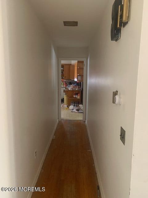49 Court Street Freehold, NJ 07728 - Photo 4 of 7 a view of a hallway with wooden floor and a bathroom