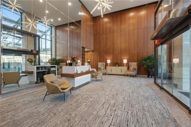 a living room with patio furniture and a fireplace