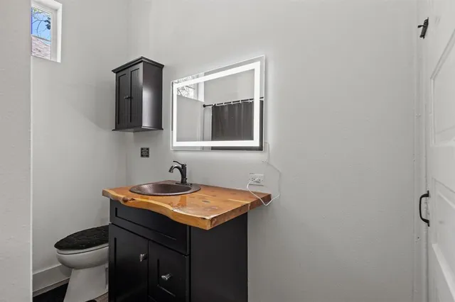 a bathroom with a sink and a toilet