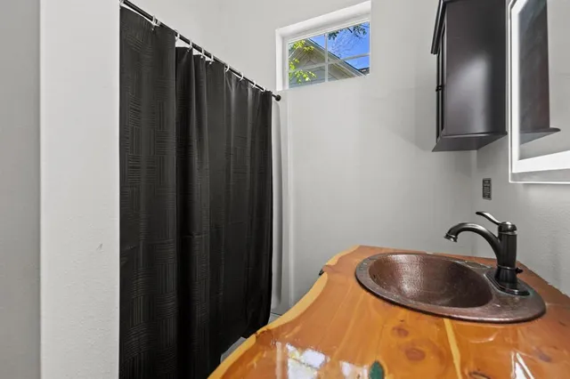 a bathroom with a sink and a mirror