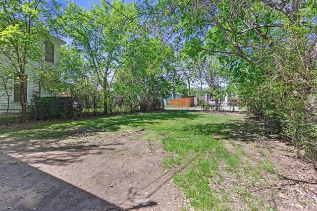 a backyard of a house with lots of green space