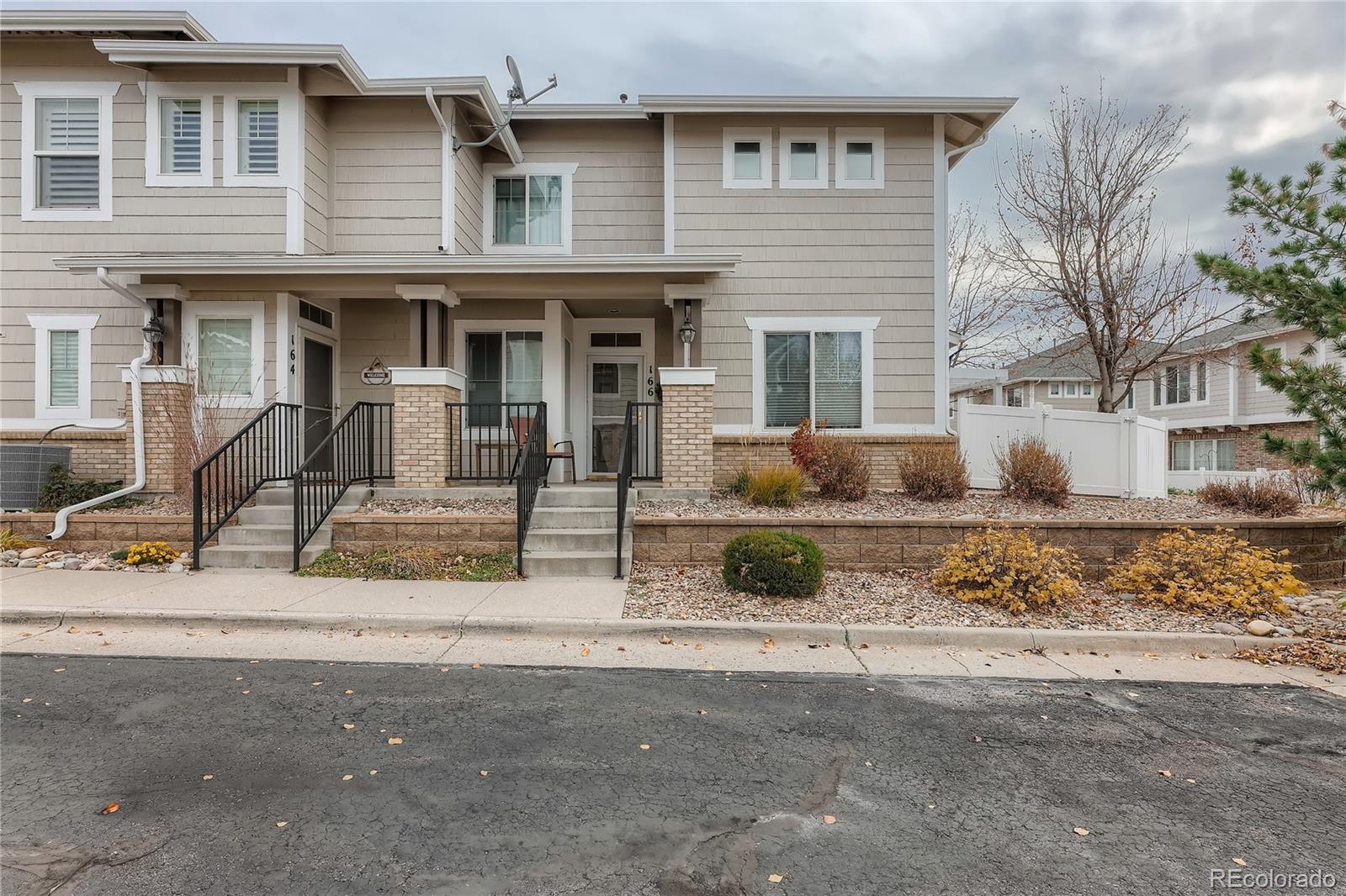 166 Whitehaven Circle Highlands Ranch, CO 80129 - Photo 1 of 28 a front view of a house with a yard and garage