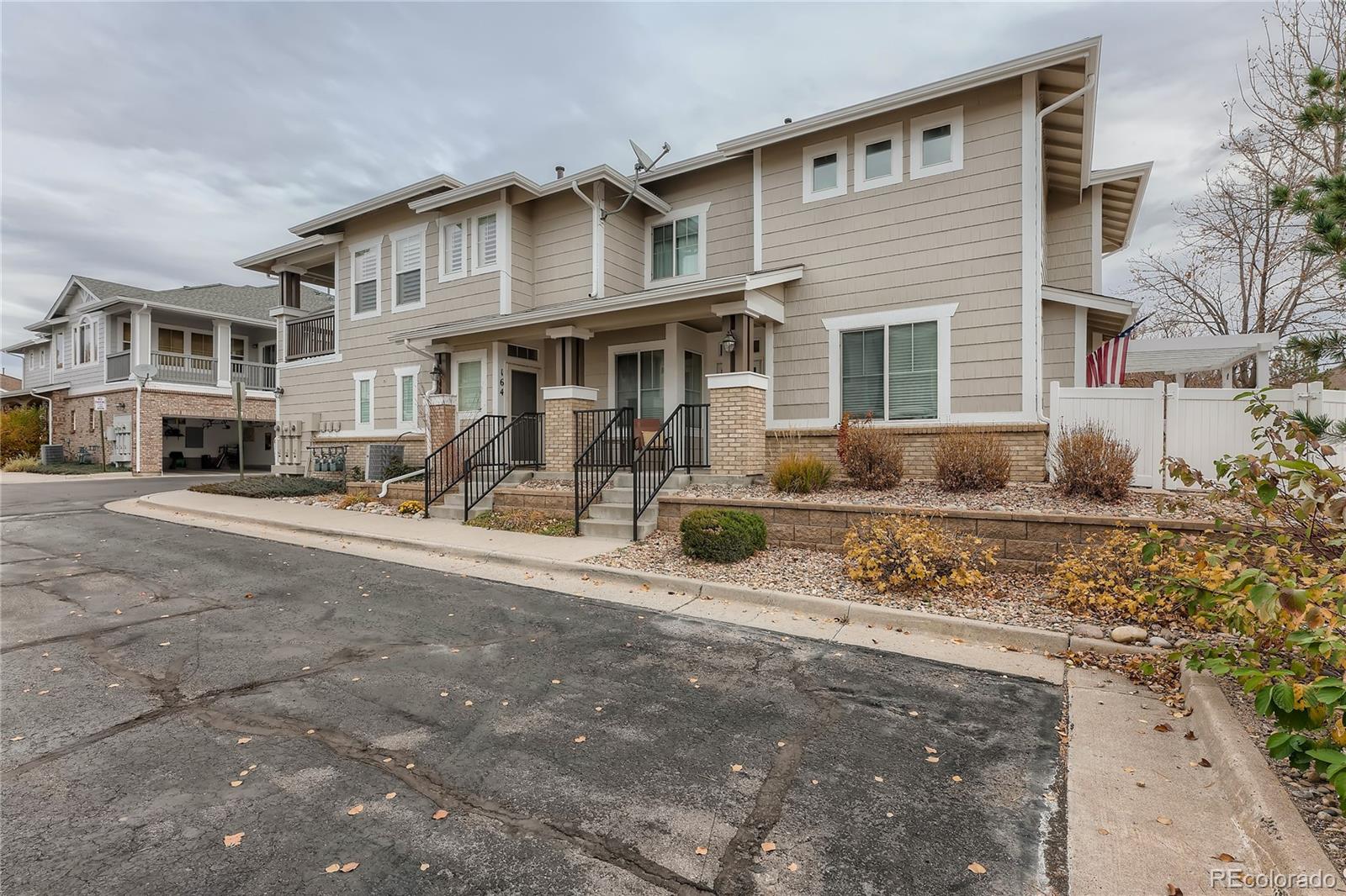 166 Whitehaven Circle Highlands Ranch, CO 80129 - Photo 2 of 28 a front view of a house with a yard