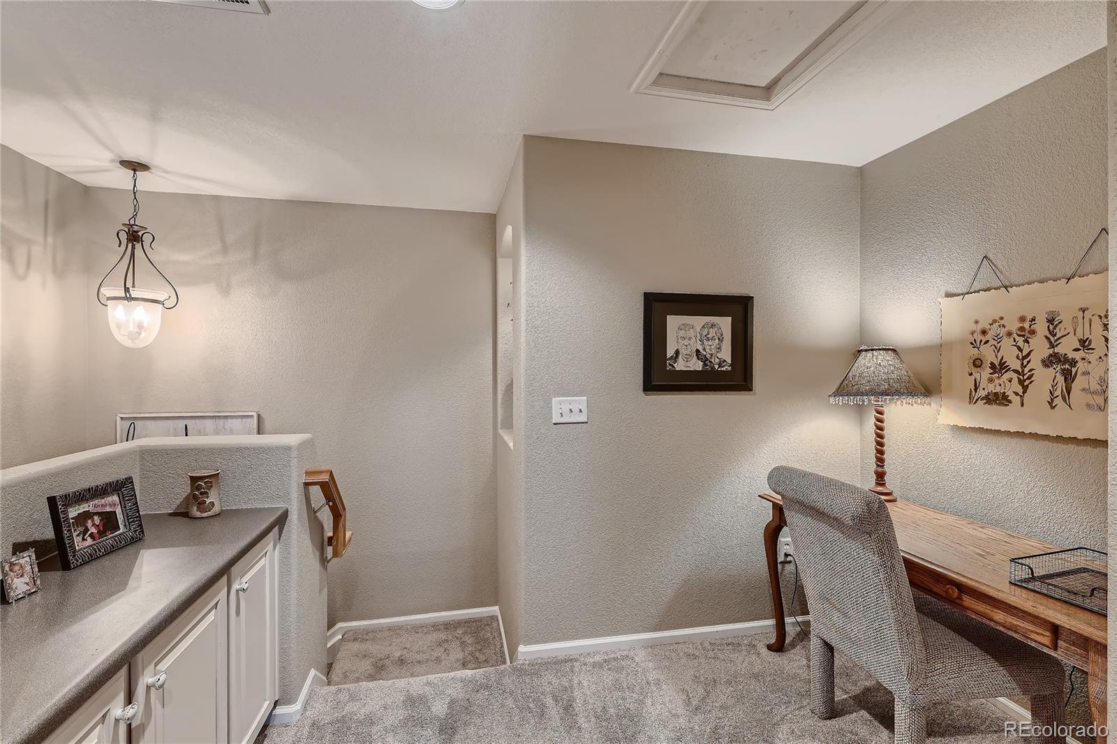 166 Whitehaven Circle Highlands Ranch, CO 80129 - Photo 21 of 28 a room with a desk and a window