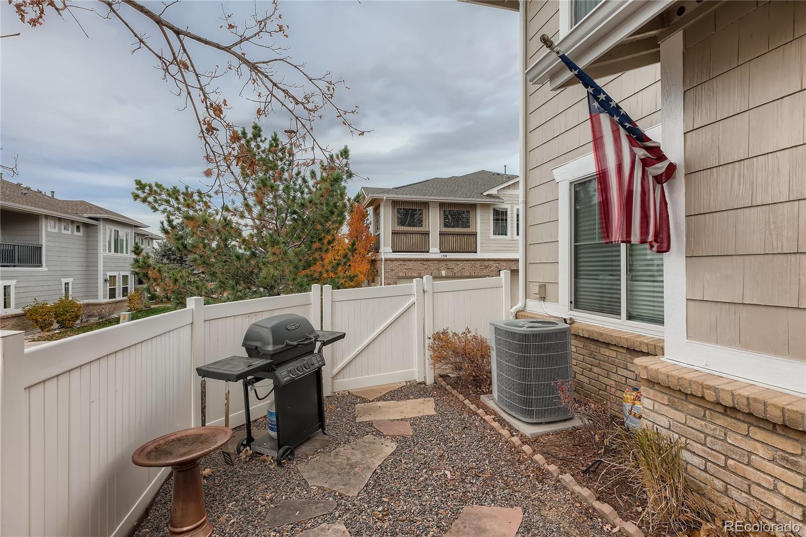 166 Whitehaven Circle Highlands Ranch, CO 80129 - Photo 28 of 28 a view of a chair and table in the backyard