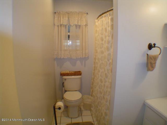 240 Crows Nest Road Manahawkin, NJ 08050 - Photo 12 of 26 a bathroom with a toilet and a shower