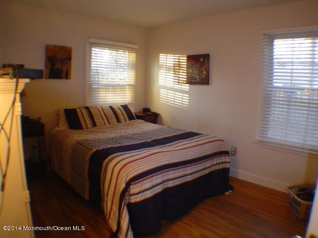 240 Crows Nest Road Manahawkin, NJ 08050 - Photo 14 of 26 a bedroom with a bed and window