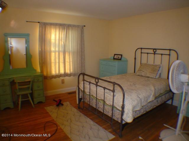 240 Crows Nest Road Manahawkin, NJ 08050 - Photo 16 of 26 a large bed sitting in a bedroom next to a window