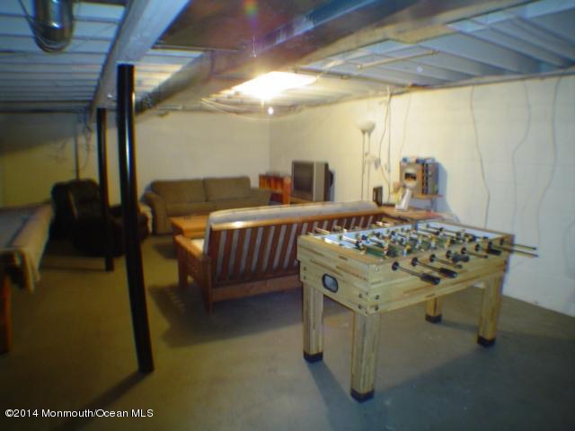 240 Crows Nest Road Manahawkin, NJ 08050 - Photo 19 of 26 a bed sitting in a room next to a larger window