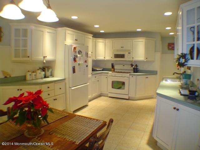 240 Crows Nest Road Manahawkin, NJ 08050 - Photo 4 of 26 a kitchen with stainless steel appliances granite countertop a sink stove and refrigerator