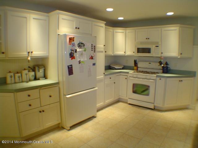 240 Crows Nest Road Manahawkin, NJ 08050 - Photo 5 of 26 a kitchen with stainless steel appliances granite countertop a stove a sink and a refrigerator