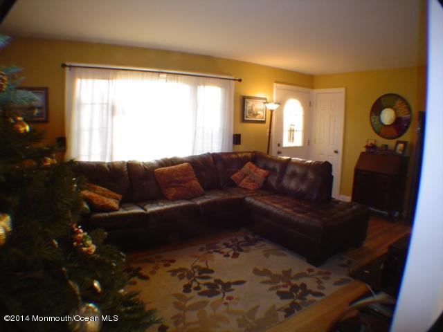 240 Crows Nest Road Manahawkin, NJ 08050 - Photo 9 of 26 a living room with furniture and a window