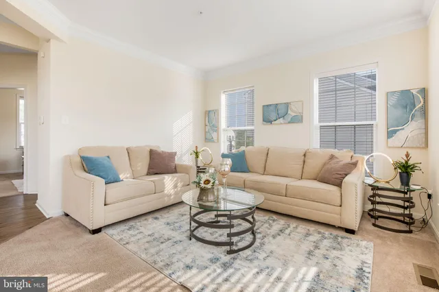 a living room with furniture or couch and a window