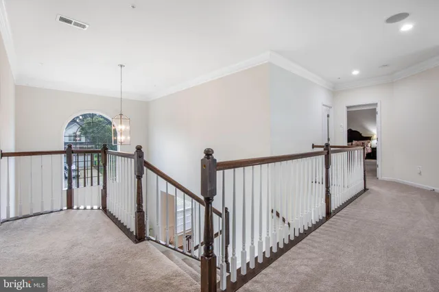 a view of a hallway with windows