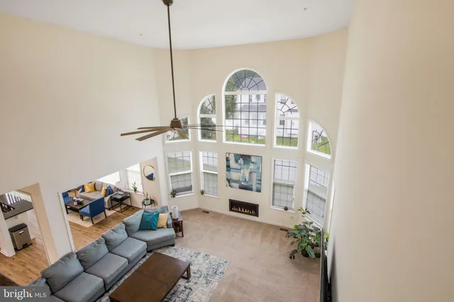 a view of living room with furniture and wooden floor
