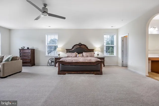 a bedroom with bed and window