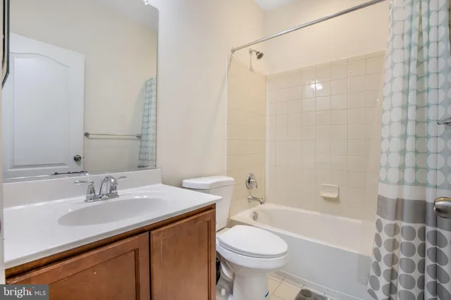 a bathroom with a sink toilet a mirror and shower