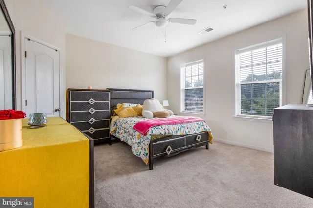 a bedroom with a bed and a table