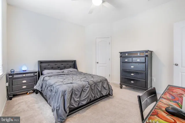 a bedroom with a bed and a mirror