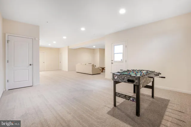 a view of a work space with wooden floor and a window