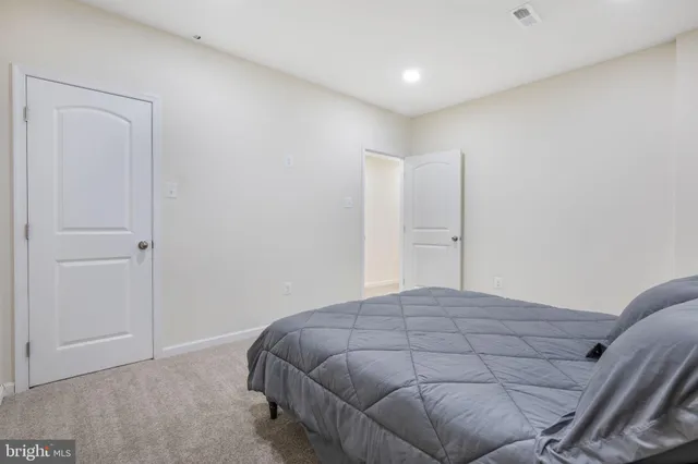 a bedroom with a bed and closet