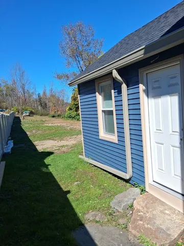 a backyard of a house with lots of green space