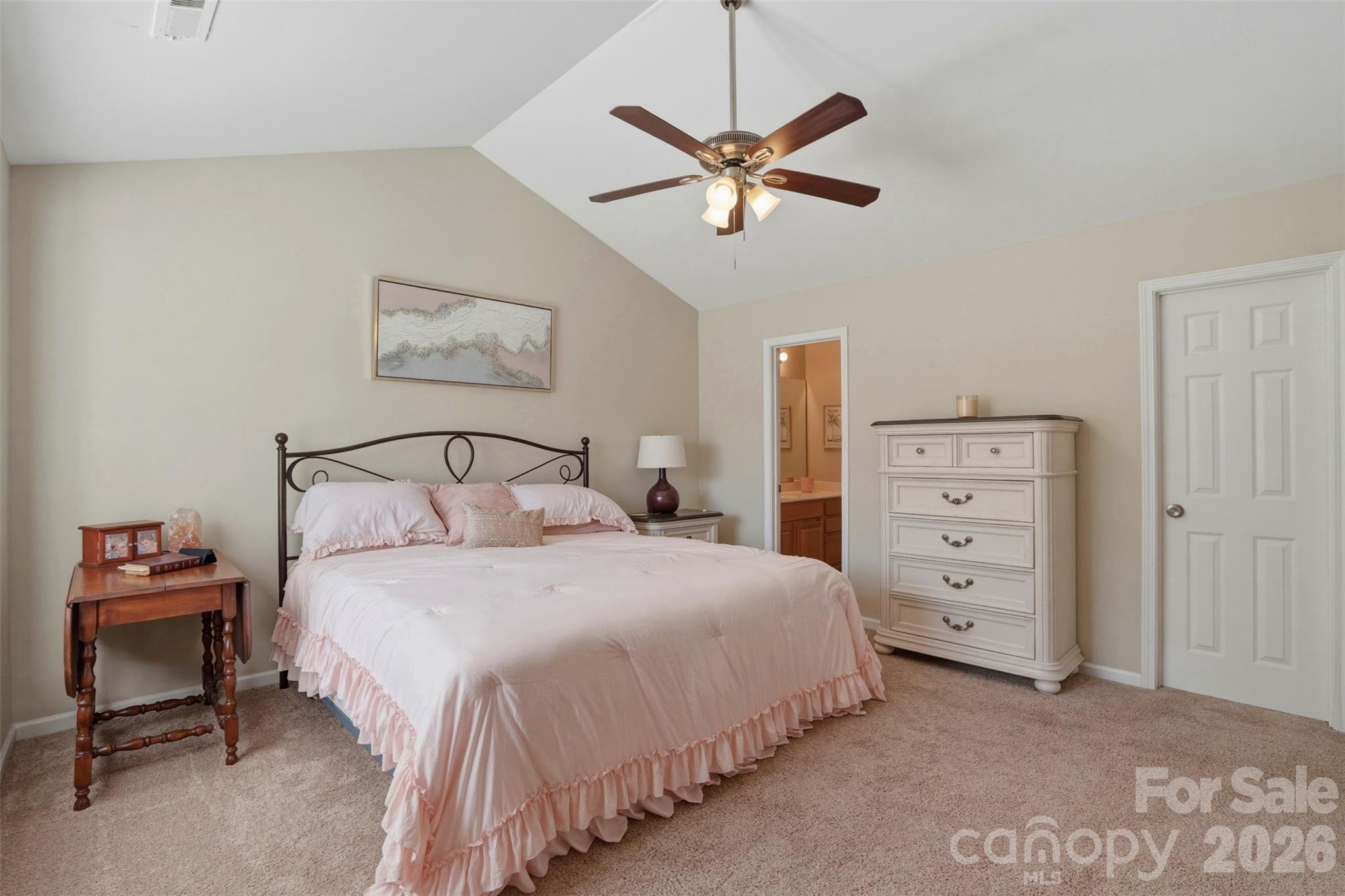 2262 Hanover Drive Fort Mill, SC 29707 - Photo 14 of 26 a bedroom with a bed and a chandelier