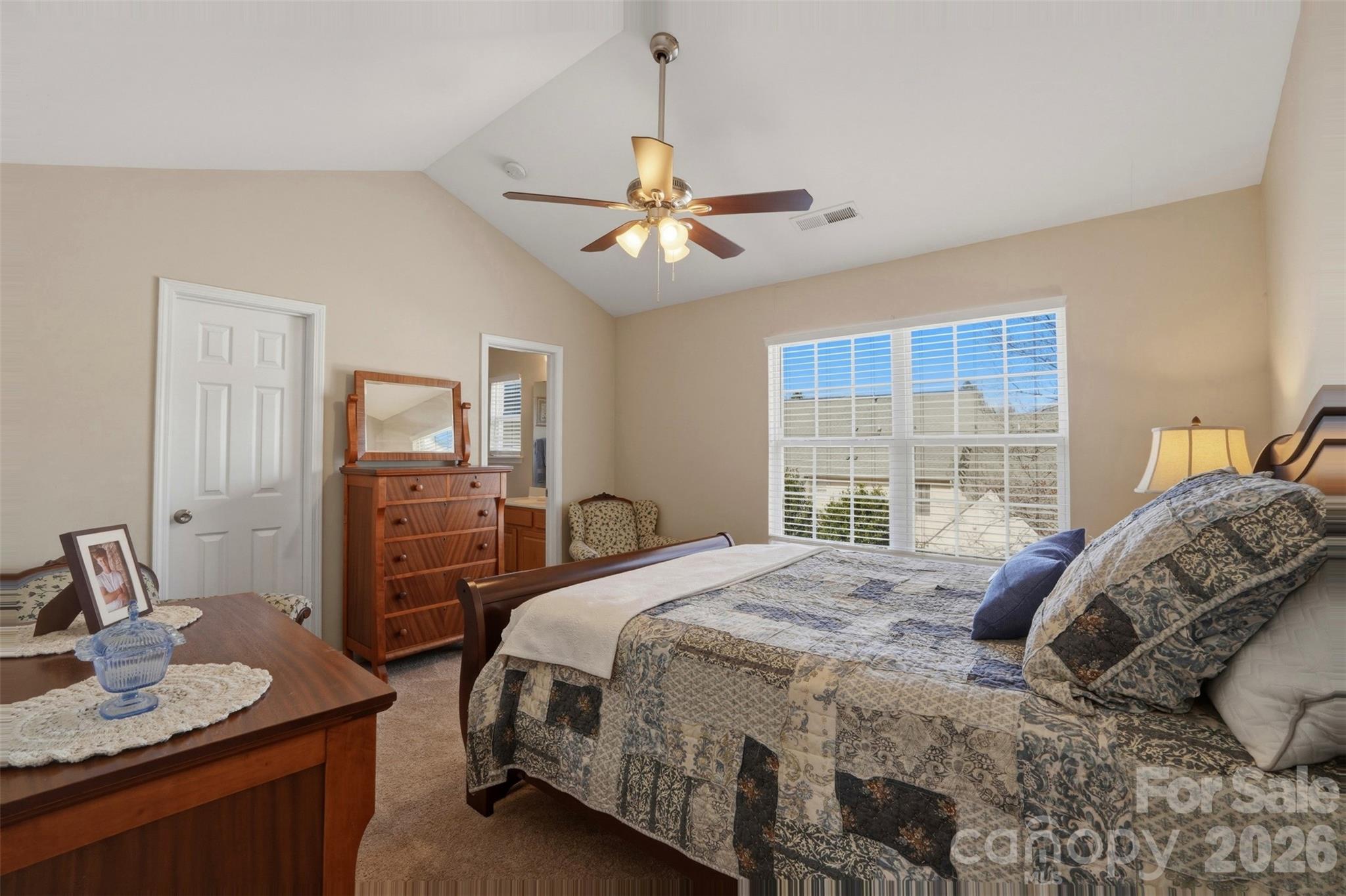 2262 Hanover Drive Fort Mill, SC 29707 - Photo 17 of 26 a bedroom with a bed and a chandelier