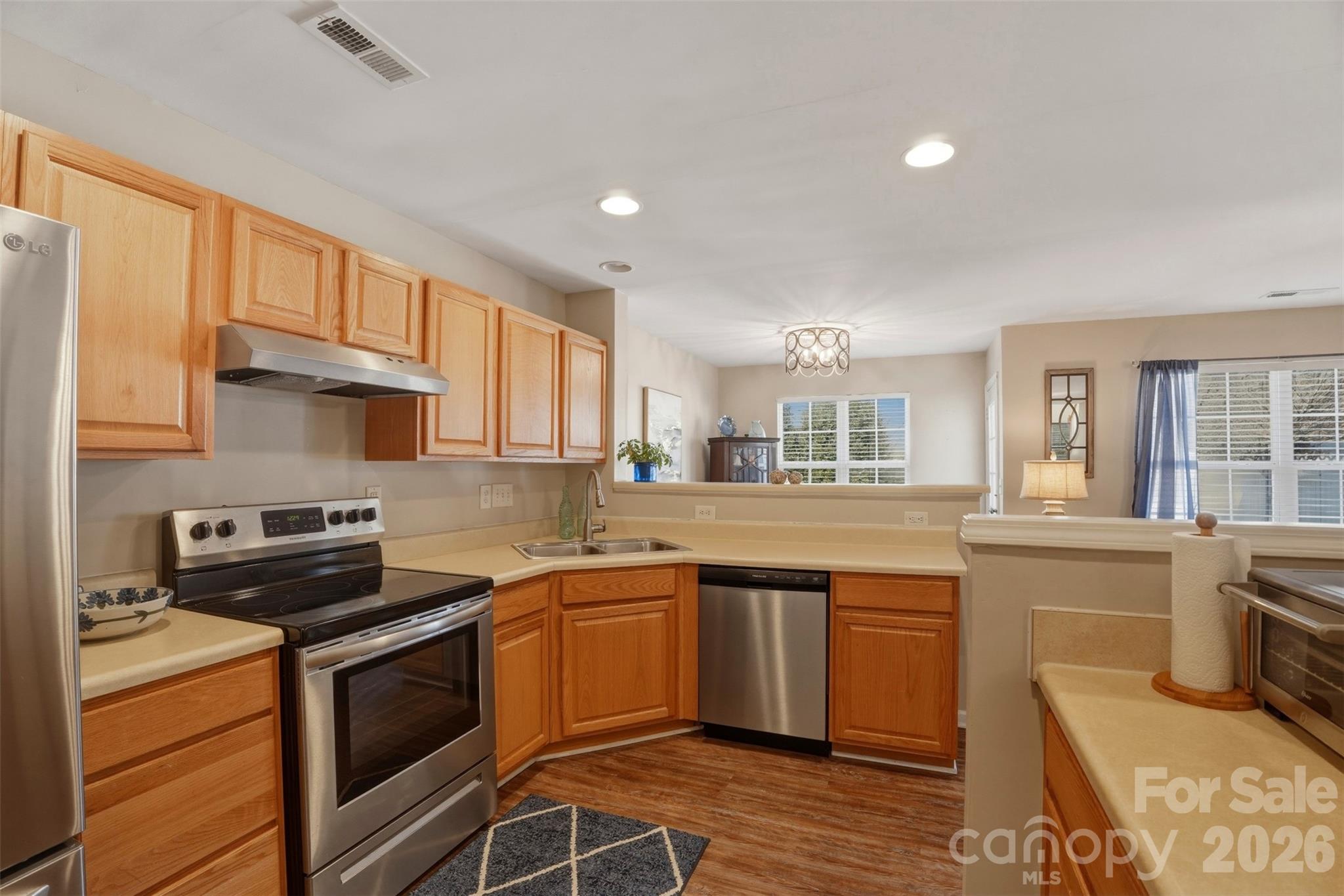 2262 Hanover Drive Fort Mill, SC 29707 - Photo 6 of 26 a kitchen with stainless steel appliances granite countertop a stove a sink dishwasher and a refrigerator
