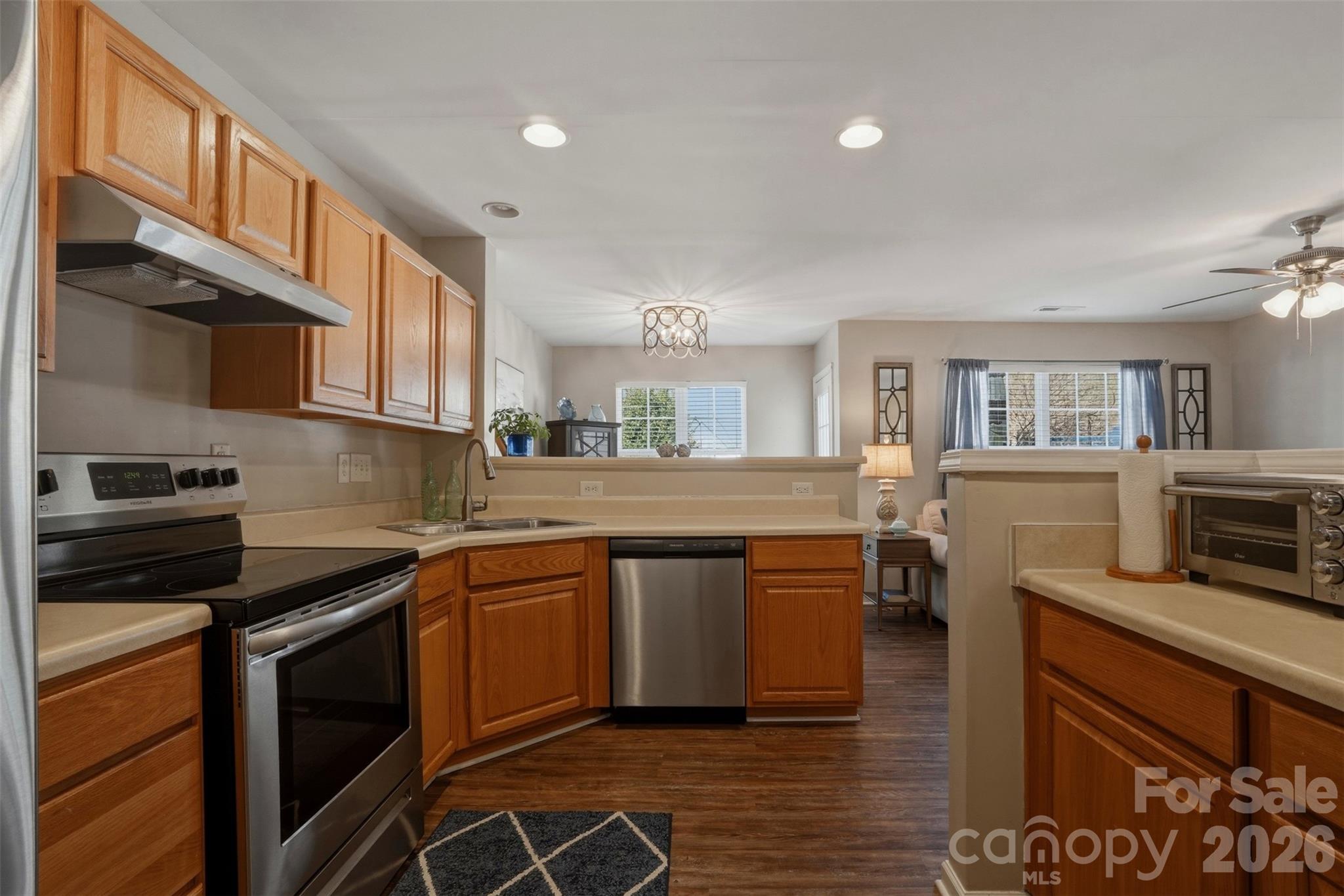 2262 Hanover Drive Fort Mill, SC 29707 - Photo 7 of 26 a kitchen with stainless steel appliances granite countertop a stove a sink and a microwave