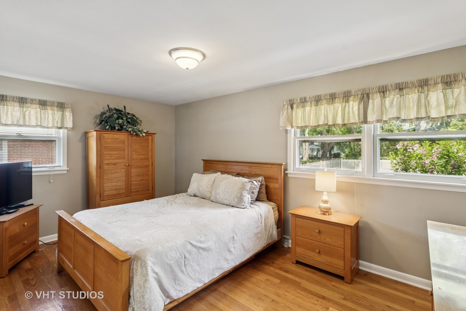 53 North Main Street Glen Ellyn, IL 60137 - Photo 13 of 30 a bedroom with a bed and a window