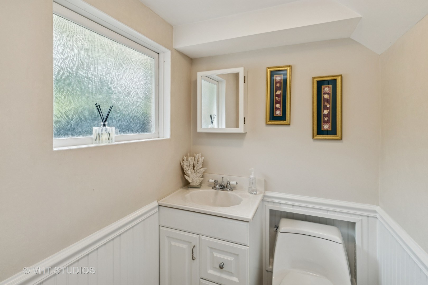 53 North Main Street Glen Ellyn, IL 60137 - Photo 19 of 30 a bathroom with a sink and a mirror