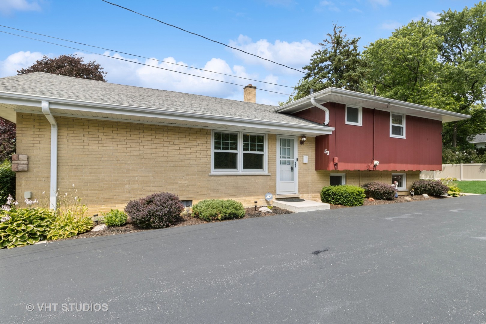 53 North Main Street Glen Ellyn, IL 60137 - Photo 25 of 30 a front view of a house with a yard