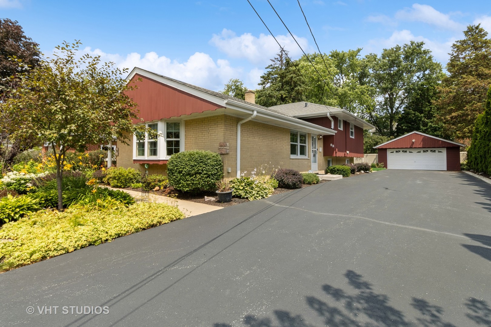 53 North Main Street Glen Ellyn, IL 60137 - Photo 29 of 30 a front view of a house with a yard and garage