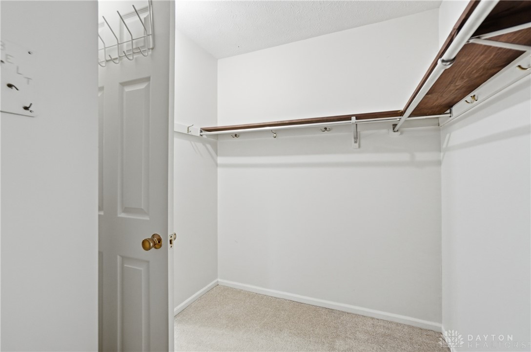9964 Hummingbird Way Dayton, OH 45458 - Photo 35 of 57 This spacious walk-in closet offers ample storage and organization solutions.