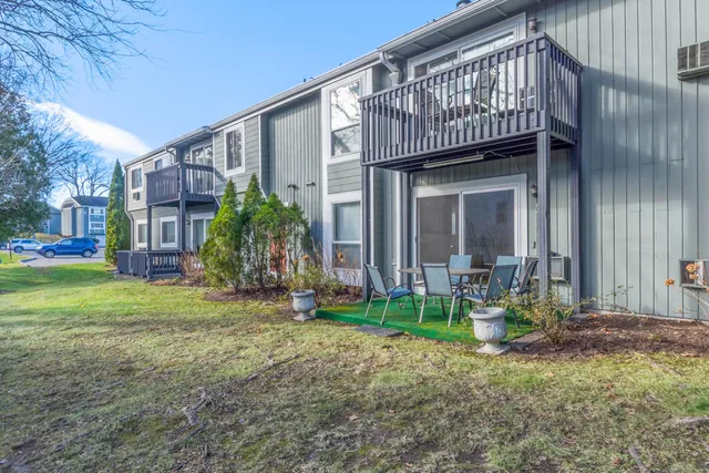 a view of an house with backyard porch and sitting area