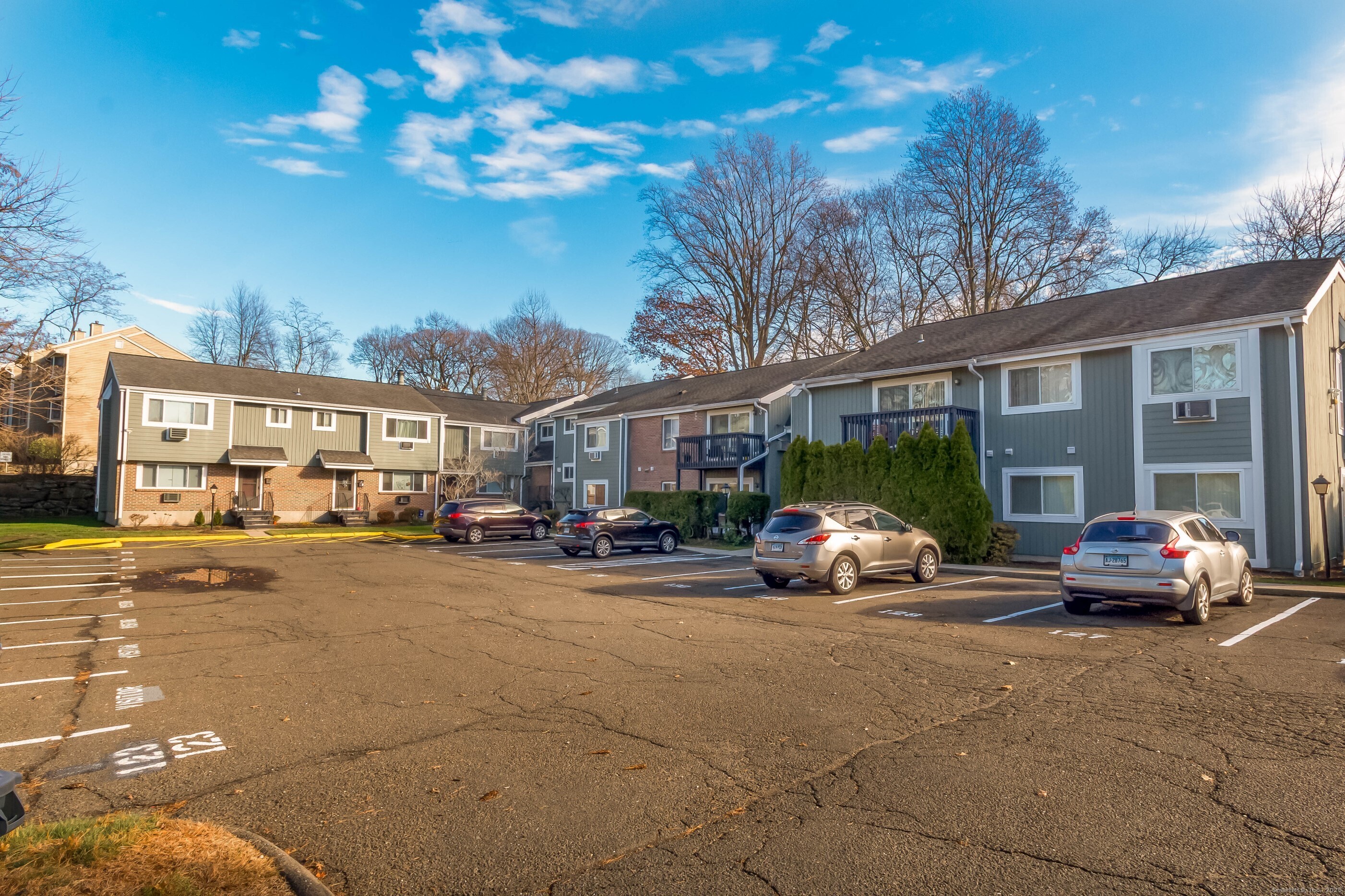 533 Glendale Avenue, Unit 533 Bridgeport, CT 06606 - Photo 3 of 15 a view of a cars park in front of a building