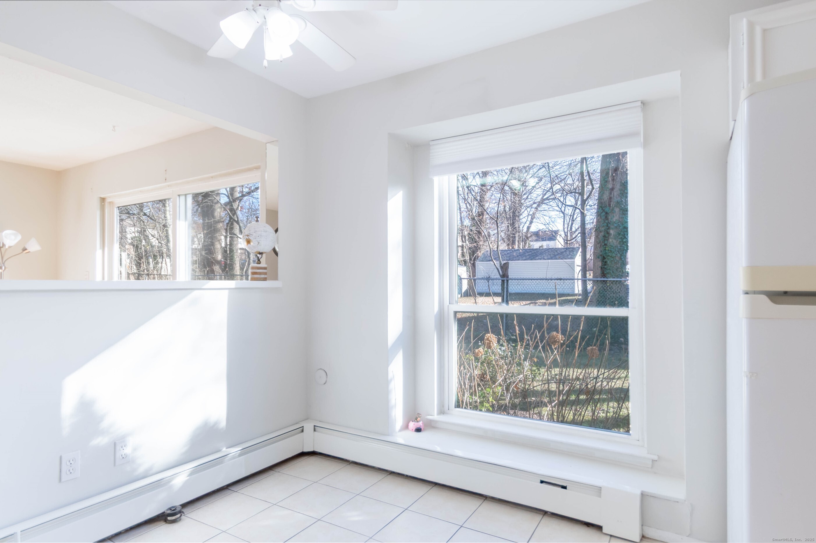 533 Glendale Avenue, Unit 533 Bridgeport, CT 06606 - Photo 7 of 15 an empty room with windows