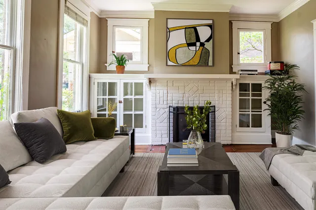 a living room with furniture and a fireplace