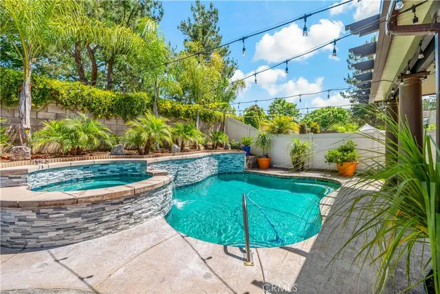 a view of a swimming pool with a patio