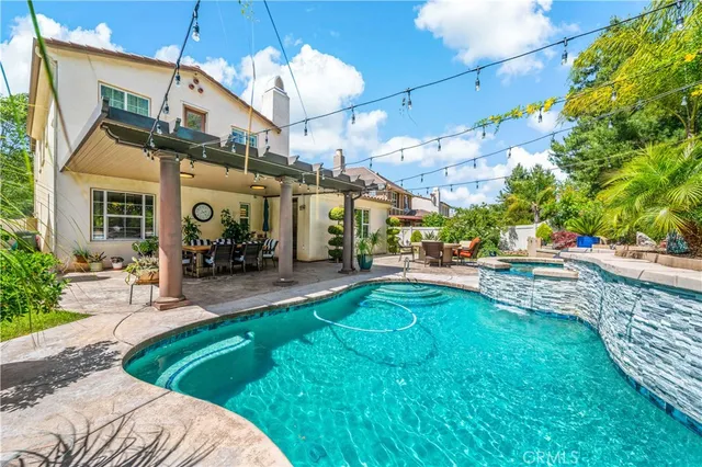 a view of a backyard with sitting area