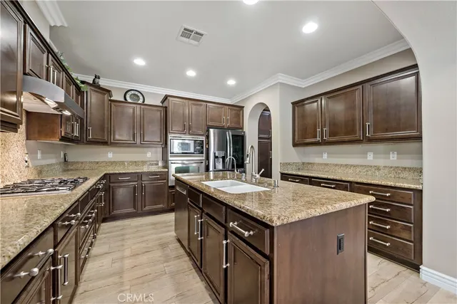 a kitchen that has a lot of cabinets in it
