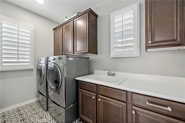 an aerial view of a house with garden space and street view