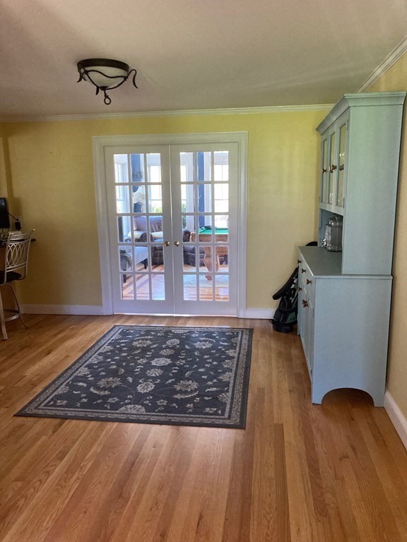 172 Sterling Road Lancaster, MA 01523 - Photo 8 of 41 a living room with wooden floor and a rug