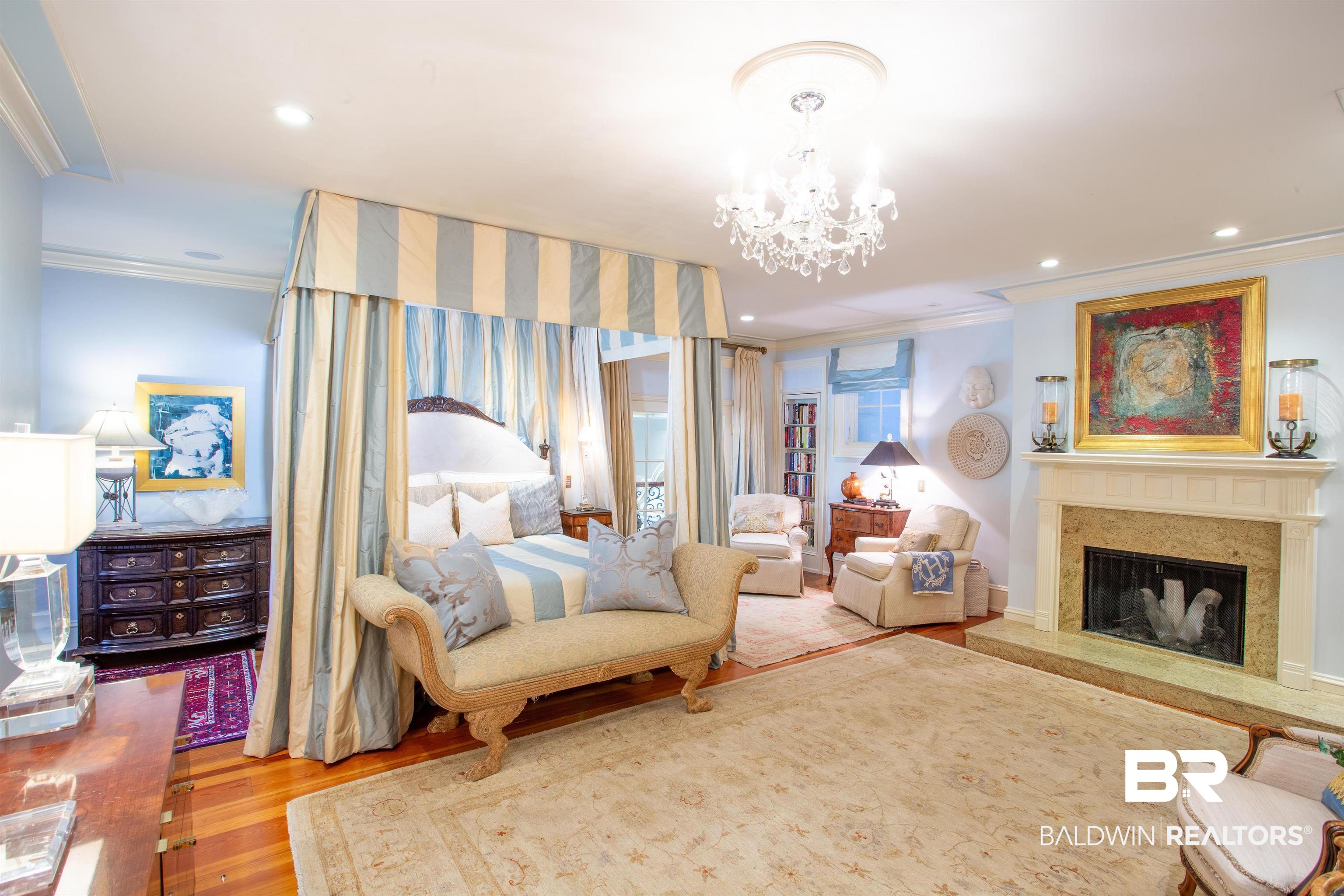 150 Austill Avenue Mobile, AL 36608 - Photo 24 of 39 Spacious room with light blue walls and hardwood flooring