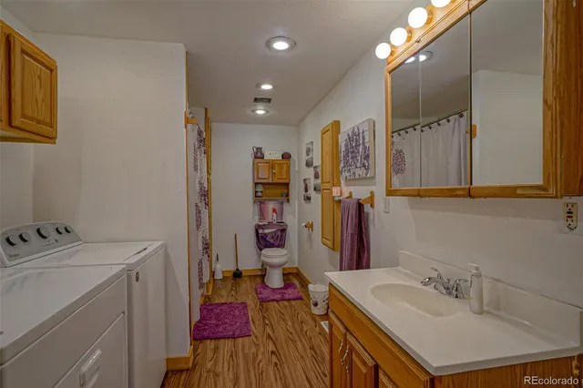 a bathroom with a sink vanity and a mirror