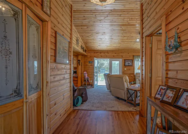 a view of a balcony with chair and wooden floor