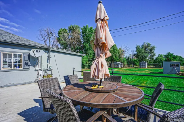 a view of a table and chairs in the patio